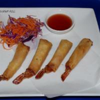 A11. Shrimp in a Blanket · Marinated shrimp wrapped with rice sheet and deep-fried. Served with plum sauce.
