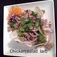 SL4. Chicken Salad (Larb) · Minced chicken with scallions, red onions, mint and rice powder in spicy lime dressing. Spicy.