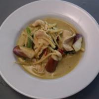 C2. Green Curry · Eggplant, basil and bell peppers in coconut curry with green paste. Spicy. Served with jasmi...
