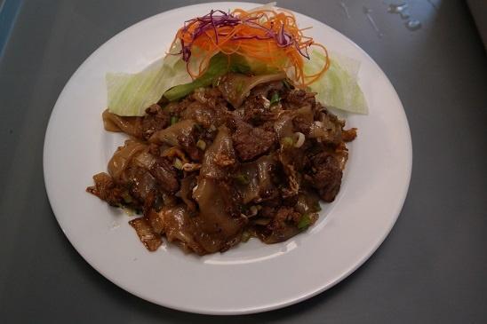 N3. Pad Kee Mow · Sauteed flat noodles, bamboo shoots, basil, bell peppers and onions in basil sauce. Spicy.