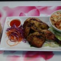CS1. Thai Barbeque Chicken · Grilled half chicken served with green papaya salad, sticky rice and sweet chili sauce.