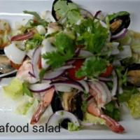 CS6. Spicy Seafood Salad · Mixed seafood, mint, red onions and lemongrass with spicy lime dressing. Spicy.