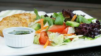 Side Salad · Lettuce, tomatoes, cucumber and carrots. Served with garlic bread. 