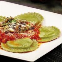 Spinach Ravioli · Ravioli, topped with tomato sauce and melted mozzarella cheese. 