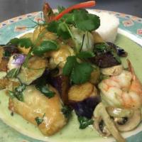 Salmon and Prawns · Eggplants and mushroom green curry. Served with steamed veggies and Thai basil.