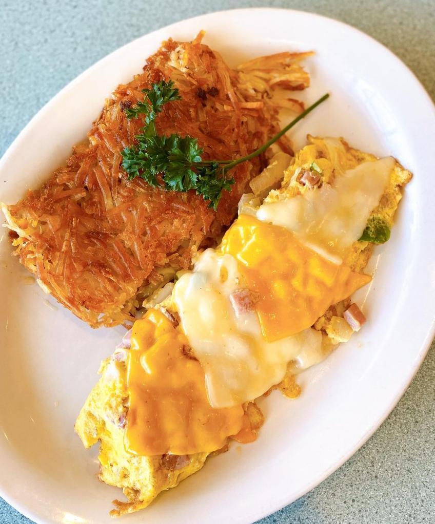 Denver Omelette · Diced ham, onions and bell peppers. Topped with cheddar and jack cheese.