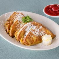 French Toast Combo · Two slices of French toast served with two eggs and your choice of 4 strips of bacon, 4 saus...