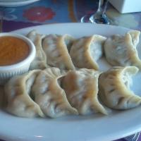 Vegetable Momo · Steamed dumplings filled with minced cabbage, spinach, mushroom, cashew nuts, onion and cila...