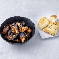 Zuppa di Cozze · Mussels with olive oil, garlic, tomato and basil in spicy or white wine sauce.