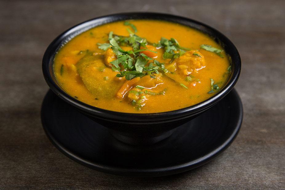 Vegetable Soup (Vegan) · Lentils cooked with vegetables, lemon flavor, curry leaves, and Indian spices.