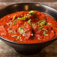 Lamb Vindaloo · Vinegar infused red chili paste and ginger. Spicy.