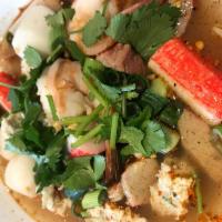 70. Tom Yum Noodle Soup · Cpicy soup with ground peanuts, BBQ pork, ground pork, shrimp, fish ball, fish cake, crab st...