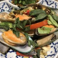 80. Steamed Mussels · 1/2 shell mussel with lemon grass, basil and homemade sauce.