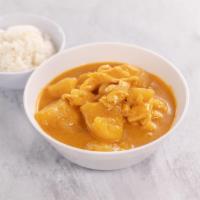 58. Topaz Curry · Chicken in smooth Thai yellow curry, potatoes, and onions with coconut milk. Served with ste...