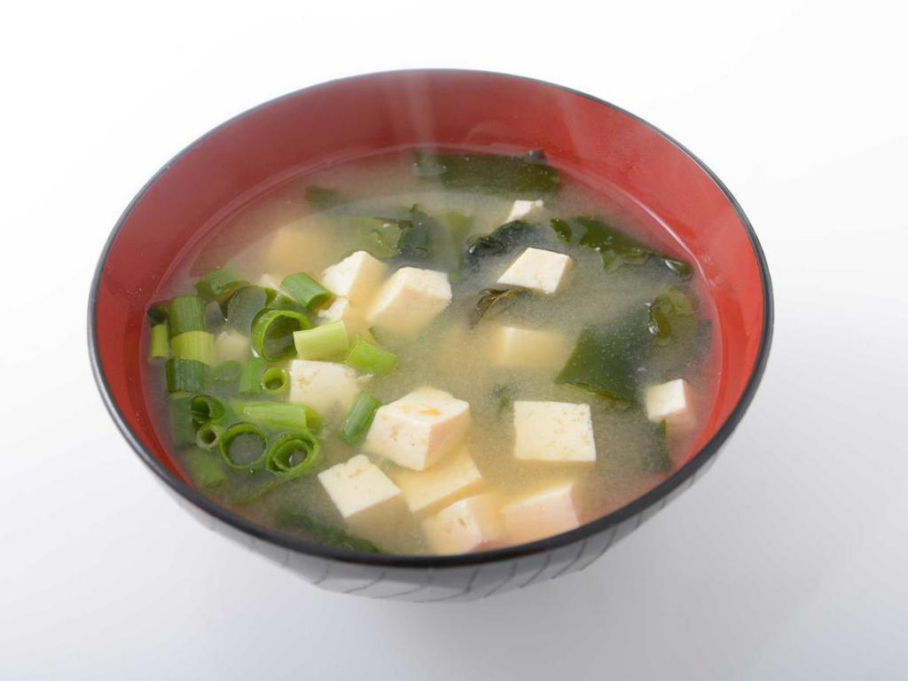 Miso Soup · Traditional Japanese soup consisting soybean paste, tofu, seaweed, green collard, and green onion.