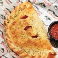 Calzone · Mozzarella cheese wrapped with butter-brushed dough, sprinkled with parmesan and oregano, th...