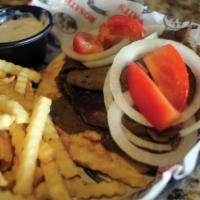 Gyro Sandwich · Beef gyro on pita bread topped with onions and tomatoes, with a side of tzatziki sauce. Serv...