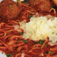 Spaghetti and Meatballs · Traditional spaghetti with marinara sauce served with homemade meatballs and topped with fre...