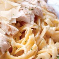 Fettuccine Alfredo with Grilled Chicken · Fettucini noodles and grilled chicken tossed in a rich, creamy Alfredo sauce made with Asiag...