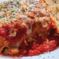 Lasagna · Homemade from the family recipe: layers of ribbon noodles and three cheeses, smothered in ma...