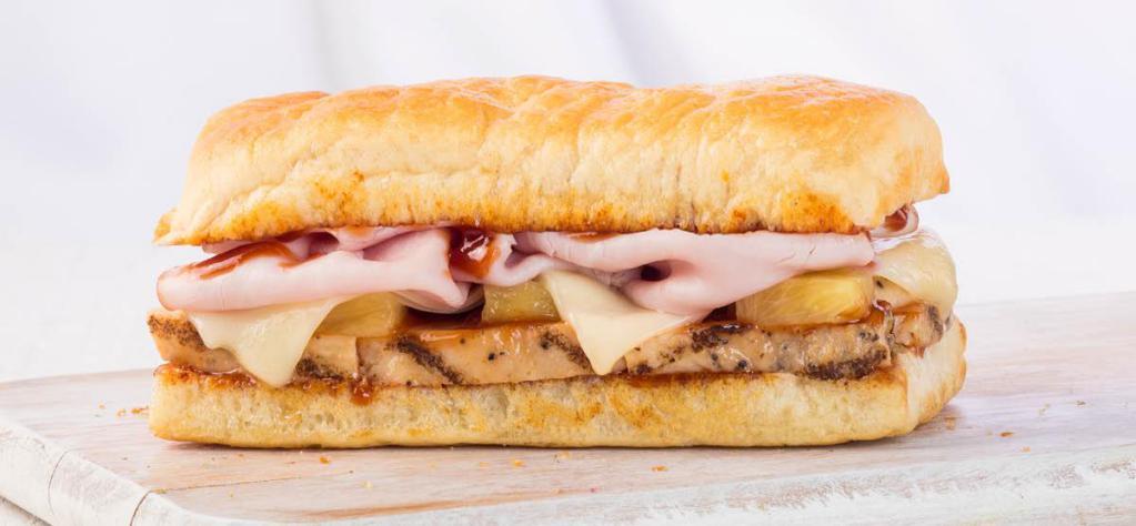 Hawaiian BBQ Sandwich · Grilled chicken, ham, Swiss, pineapple, and BBQ sauce. Freshly baked on our Artisan bread.