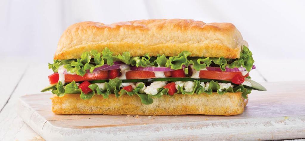Veggie Sandwich · Feta, cucumber, red peppers, red onions, lettuce, Roma tomato, and creamy Mediterranean dressing. Freshly baked on our Artisan bread.