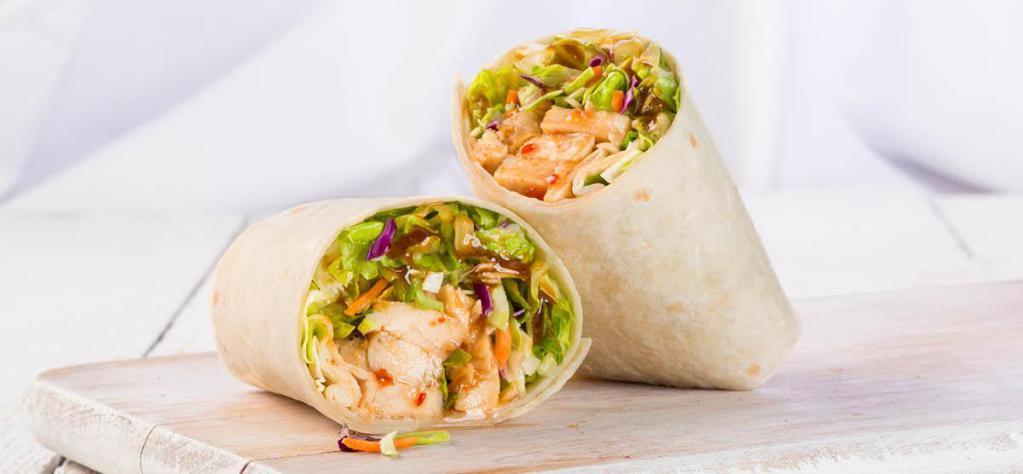 Thai Chicken Wrap · Grilled chicken, romaine, Chinese greens mix, sweet chili sauce, and Thai peanut dressing.
