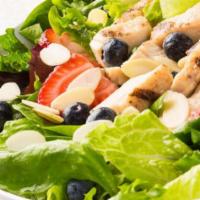 Berry Chicken Almond Salad · Spinach, spring lettuce, grilled chicken, fresh strawberries, fresh blueberries, almonds and...