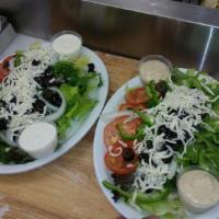Tossed Salad · Romaine lettuce, spring mix, bell peppers, black olives, tomatoes and mozzarella cheese with...