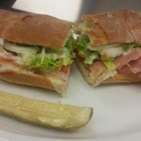 Italian Combo Sandwich · Ham, salami, pepperoni, and provolone on a hoagie and toasted. Topped with lettuce, tomato, ...