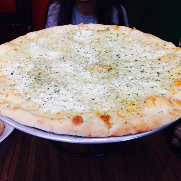 The Italiano Pizza · Fresh garlic, ricotta, fresh mozzarella cheese, and oregano. Does not have marinara sauce. Uses an olive oil sauce.