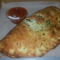 Create Your Own Calzone · Comes with 1 filling of your choice, ricotta and mozzarella cheese. Add fillings for an addi...