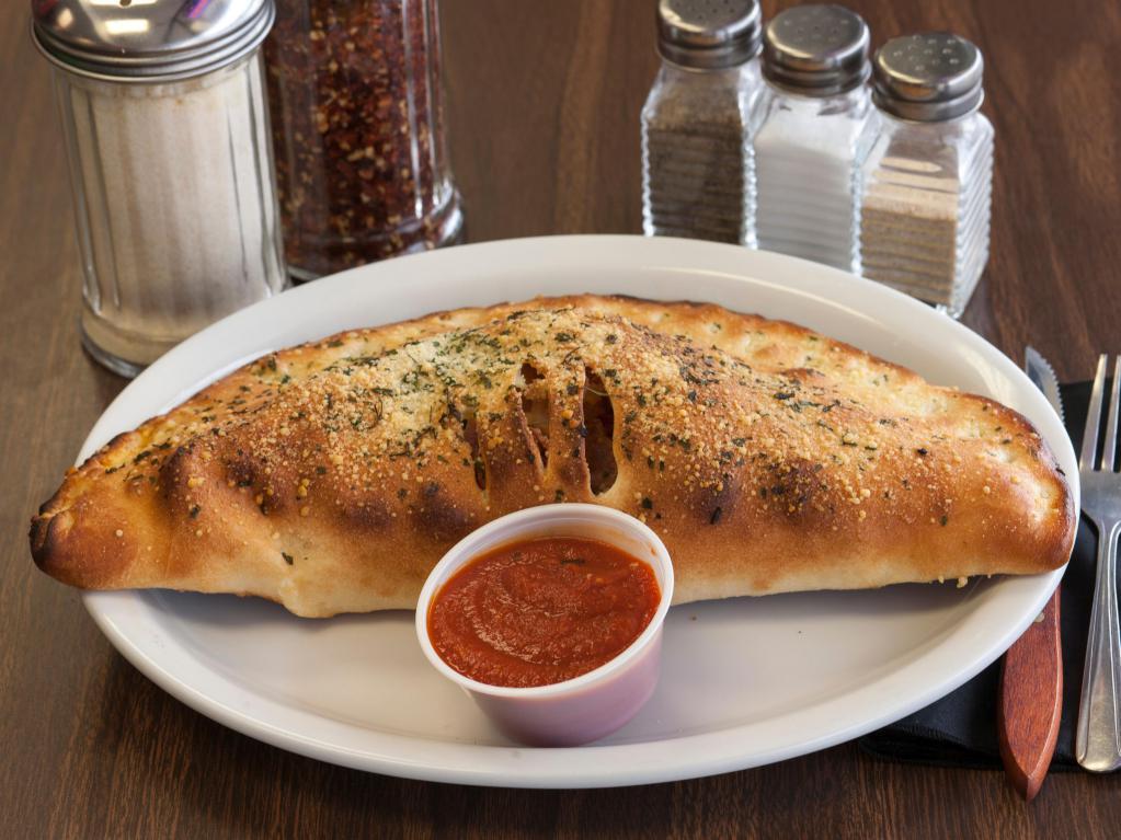 Combination Calzone · Pepperoni, sausage, bell peppers, red onions, mushrooms, ricotta and mozzarella cheese.