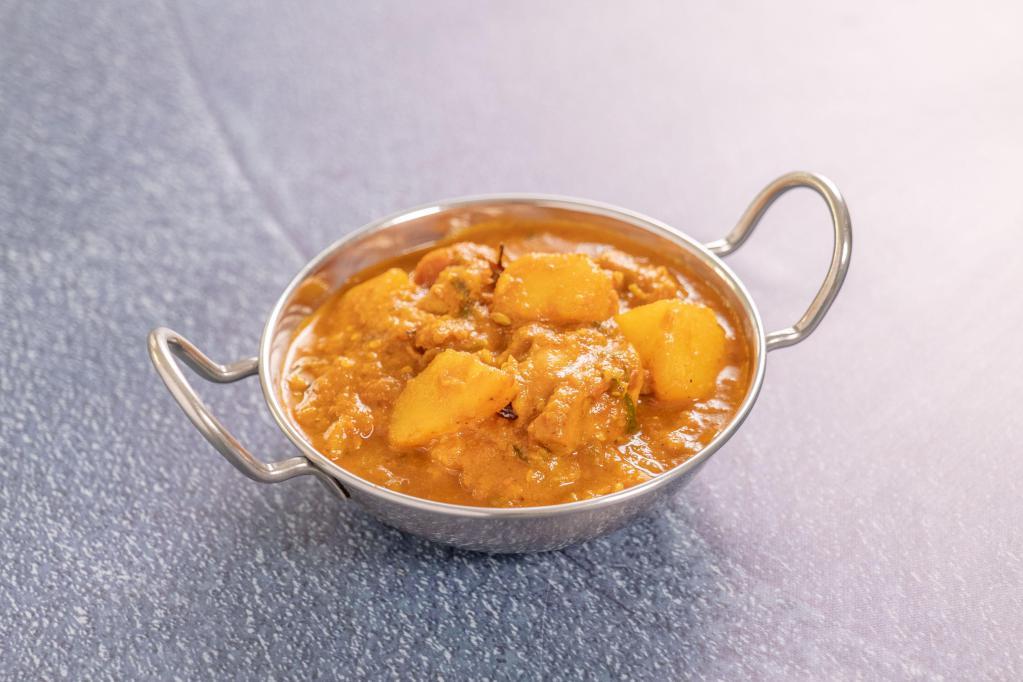 Chicken Vindaloo · Boneless chicken cooked with hot spices and potatoes.