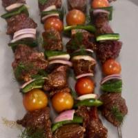 Lamb Shish Kebab · Comes with rice, Greek salad, pita bread and tzatziki or hummus.