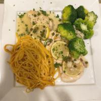 Pollo Al Limone · Double chicken breast sauteed with lemon juice, white wine and capers. Served with pasta mar...