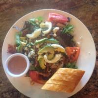 Cobb Salad · Mixed greens, avocado, chicken, hard boiled egg, bacon, tomatoes, blue cheese with a side of...