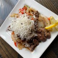 DeMatha Steak Tips · Sauteed beef tips, peppers, onion, white rice, rice noodles