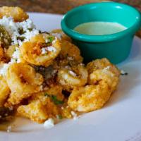 Crispy Calamari · Served with jalapeno avocado aioli, queso fresco, cilantro and lemon.