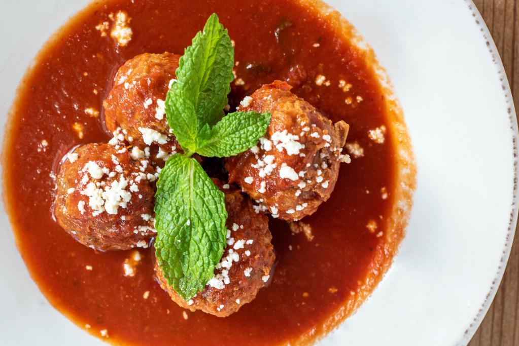 Albondigas (Mexican Meatballs) · Beef and Pork meatballs with rice, onion and bell pepper served in a fresh tomato sauce with chipotle and mint