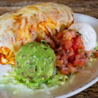 Chicken Burrito · Seasoned rice and beans, sharp cheddar, sweet and spicy chipotle sauce and cilantro lime cre...