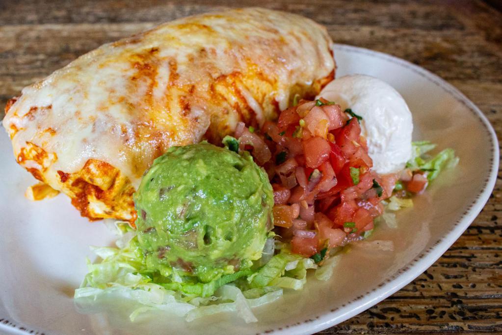Ground Beef/Chili con carne Burrito · Seasoned rice and beans, sharp cheddar, sweet and spicy chipotle sauce and cilantro lime creme.
