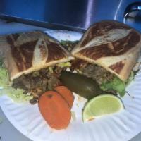 Tortas · Choice of meat onions cilantro hot or mild sauce lettuce