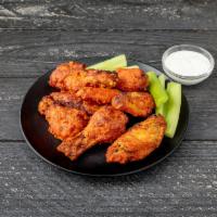 Coal-Fired Wings · Choice of traditional Buffalo or teriyaki sauce. Extra sauce for an additional charge.