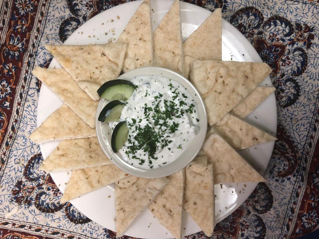 Mast O Khiyar · Yogurt, cucumber, nuts, and herbs. Served with pita bread.