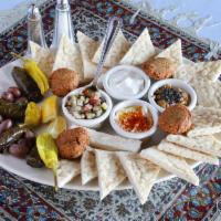 Full Mazeh Plate · Dolmas, feta cheese, Kalamata olives, falafel, shirazi salad, tzatziki, kashk o bademjoon, a...