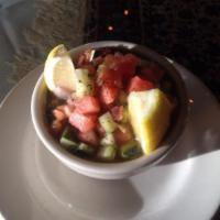 Shirazi Salad · Chopped cucumbers, tomatoes, onions, parsley, mint, lemon, and olive oil.