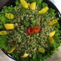 Tabouli Salad · Chopped parsley, tomaotes, onions, cracked wheat, lemon, and olive oil. Served with pita bre...