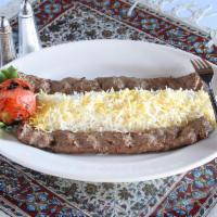 Chelo Kebab Koobideh · Marinated organic ground beef or chicken broiled over an open fire. Served with grilled toma...