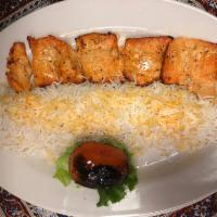 Chicken Chelo Kebab Barg · Marinated and pounded kebab broiled over an open fire. Served with grilled tomato and plan b...